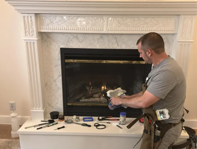 Scituate Chimney Sweep performing fireplace maintenance in Scituate, MA